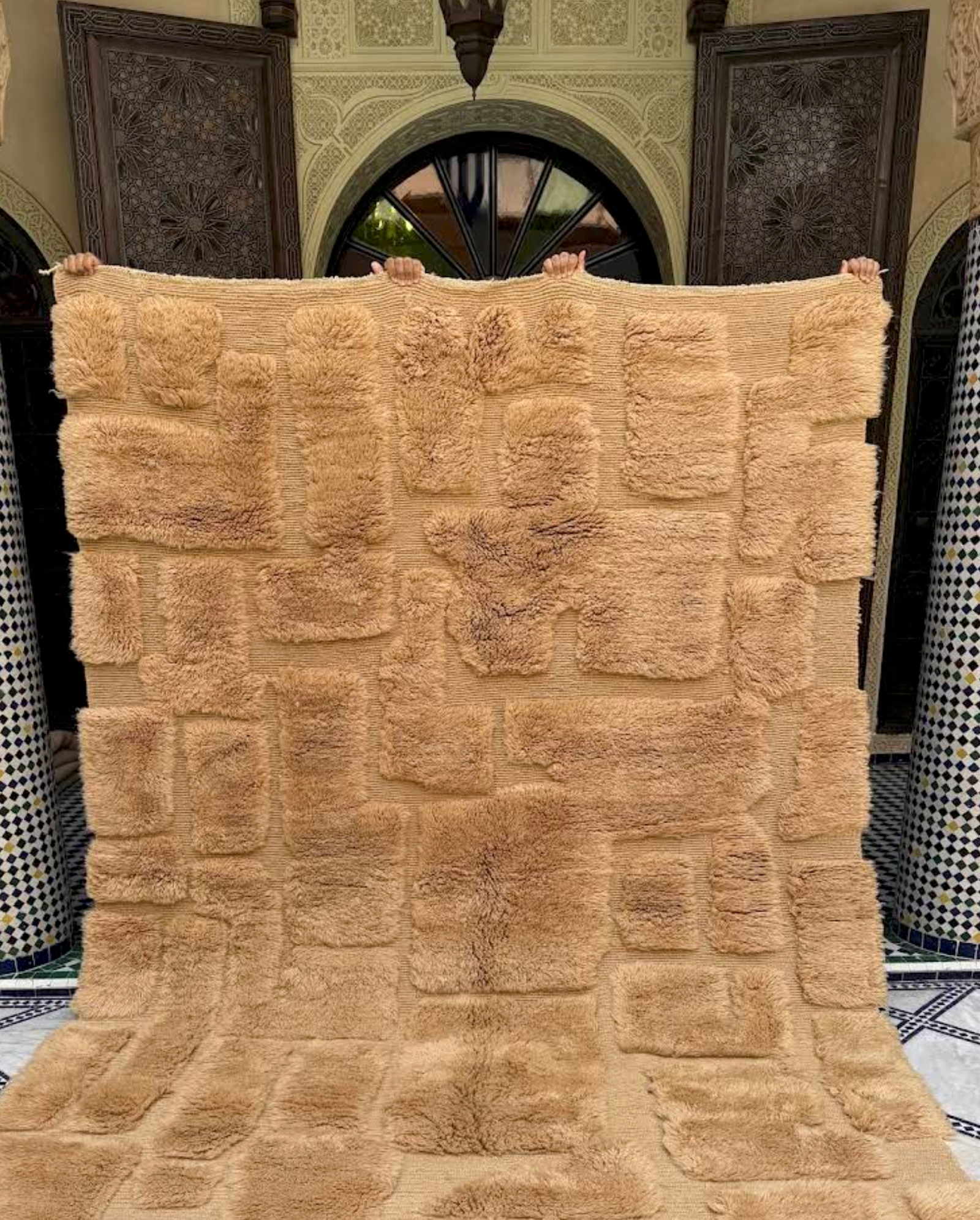 Folded Moroccan rug showing natural wool texture