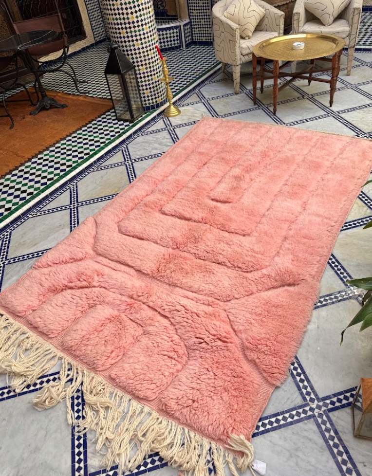 Handmade Moroccan rug with traditional motifs